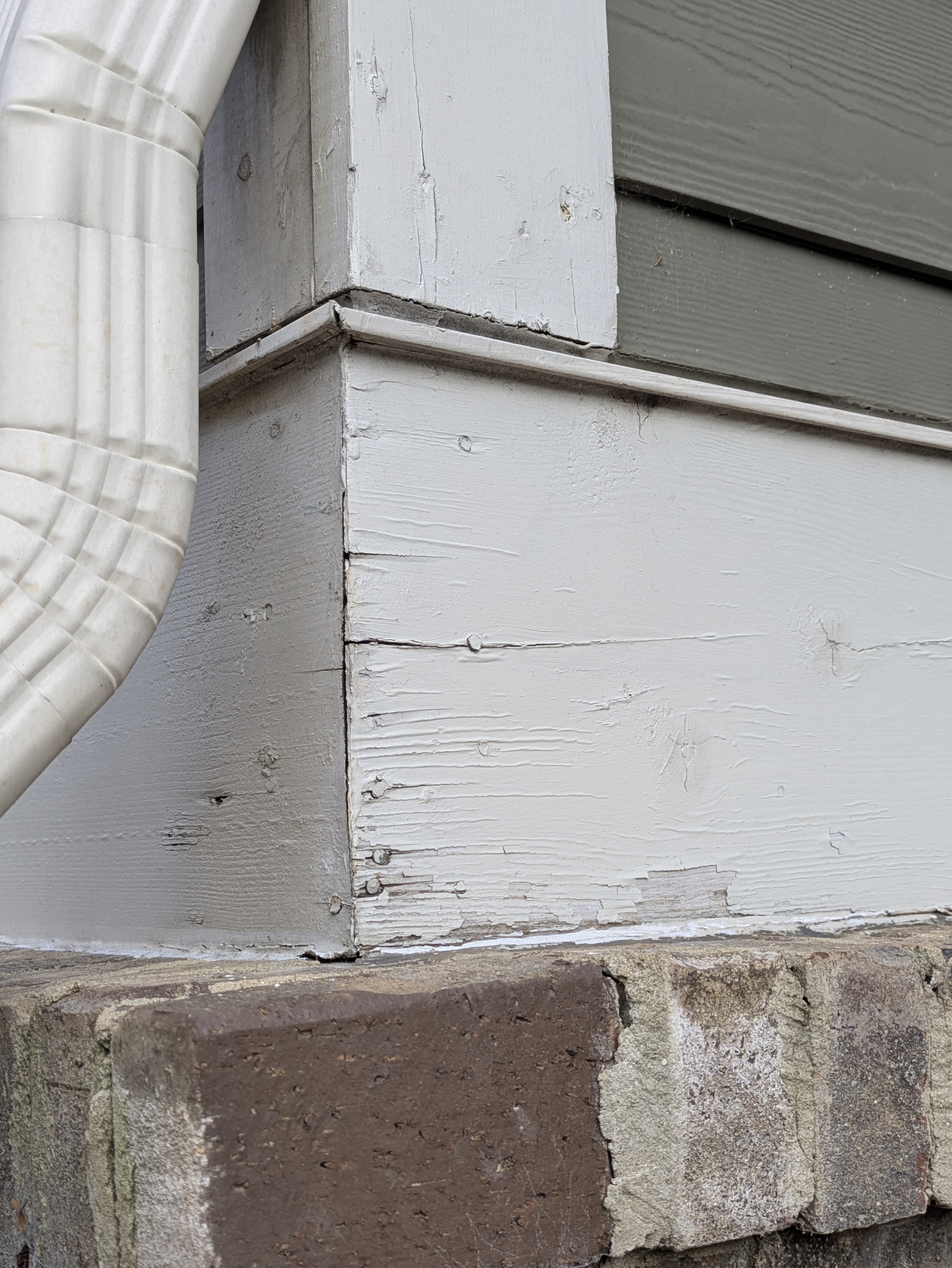 New white corner board trim installed on a renovated Athens exterior